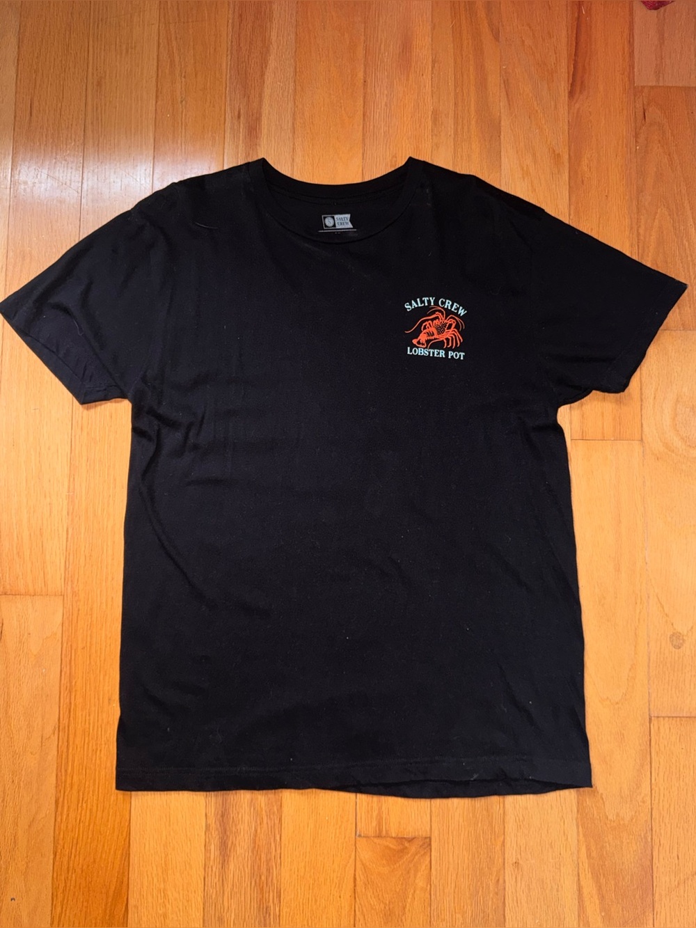 Salty Crew Black Tee with Orange Lobster Chest Logo
